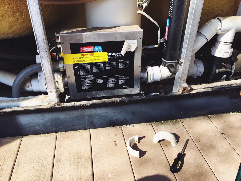Image of a hot tub motor being worked on by a technician.